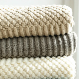 hand-knitted blanket cozy knit cream brown textured throw set view