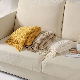 hand-knitted blanket cozy knit cream brown textured throw detail