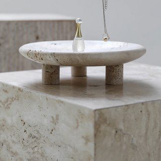 travertine stone tray earthworks luxury handcrafted three-leg artisan decor for home close-up