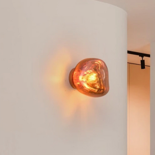 Rose gold Italian wall lamp illuminated — Lava Massimo luxury sconce