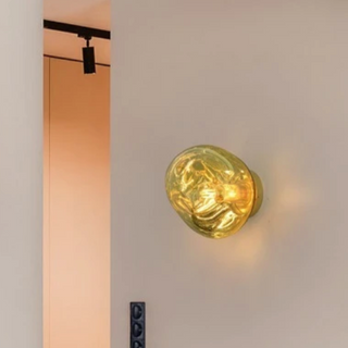 Gold Italian wall sconce illuminated — Lava premium aluminum lamp