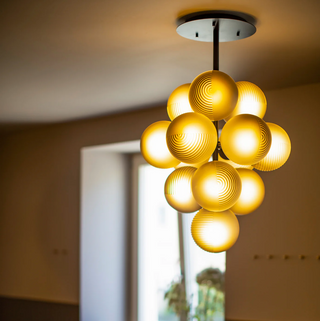 Grape cluster pendant light detail — handcrafted glass lighting fixture