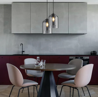 Close-up of smoky grey glass pendant — retro-modern lighting fixture