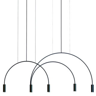 Curved metal pendant light close-up — sleek black aluminium hanging lamp