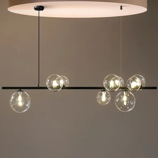 Linear bubbles pendant lamp close-up — handcrafted glass and metal fixture