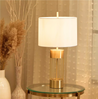 Vault-inspired gold lamp close-up — luxury detail