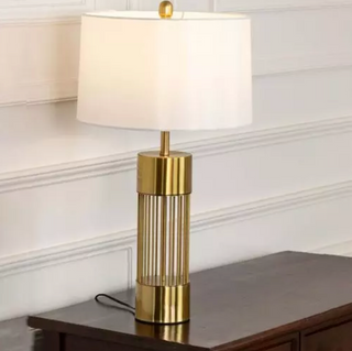 Vault-inspired luxury gold table lamp — elegant warm glow