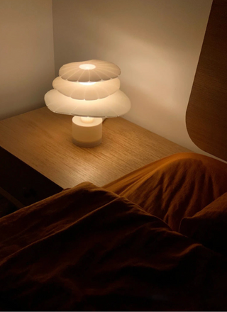 Layered table lamp illuminated — unique stylish ambient design