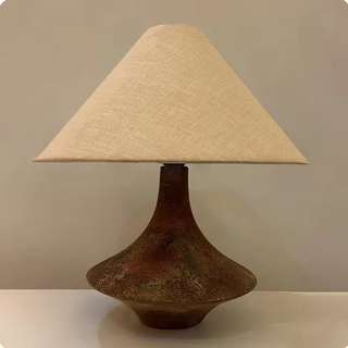 Rustic stone lamp close-up — handcrafted natural texture