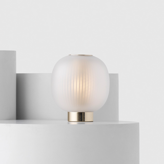 Ball-shaped table lamp front view — minimalist elegant design