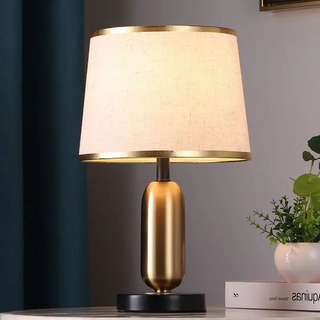 Bullet base golden lamp illuminated — luxury warm ambient