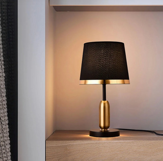 Sleek gold bullet base lamp — luxury close-up detail