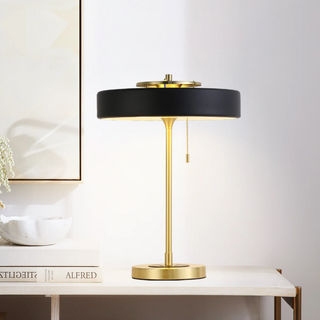 Black table lamp gold accent — close-up elegant detail