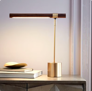 Minimalist brass base table lamp — dark wood shade luxury
