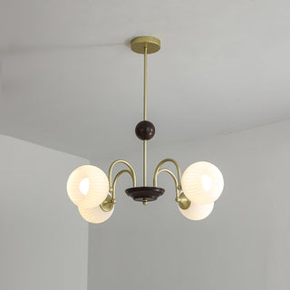 Contemporary cream glass ribbed chandelier front — dining room design