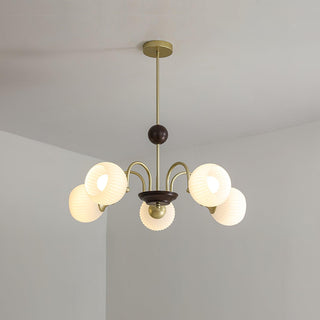 Contemporary ribbed chandelier detail — cream glass dining warm