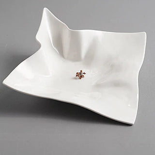 ceramic serving plate earthworks handcrafted porcelain dinnerware large elegant tableware close-up