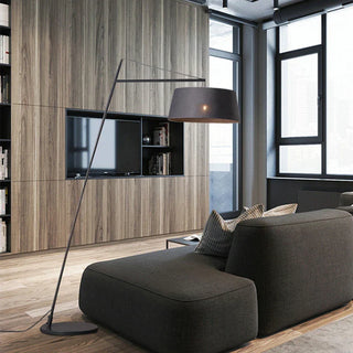 Slanting floor lamp – black metal base and arm detail