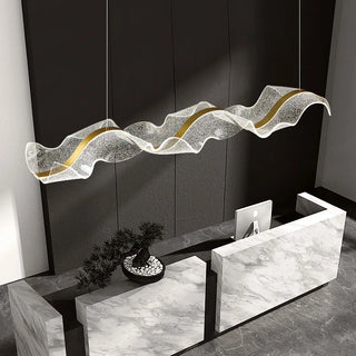 Wave pendant lamp in interior setting — statement lighting for living room