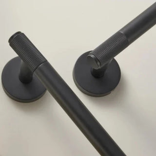 modern bathroom hardware concept black metal copper bath accessories close-up