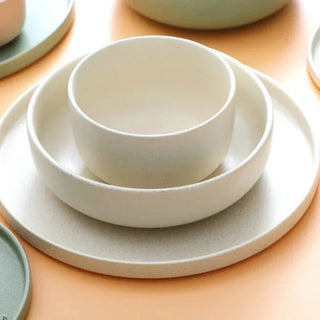 japanese ceramic dinnerware earthworks minimalist beige porcelain plates bowls handcrafted side view