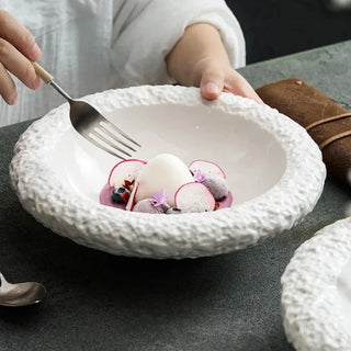ceramic plate collection earthworks handcrafted porcelain dinnerware textured edges side view