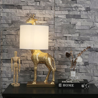Giraffe lamp wide view — designer gold LED warm