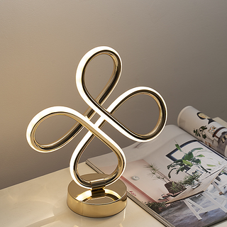 Golden loop table lamp — modern elegant close-up detail