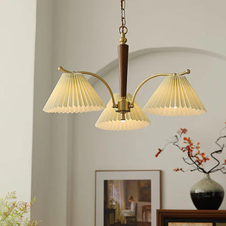 Pleated wood brass chandelier side — elegant dining warm ceiling