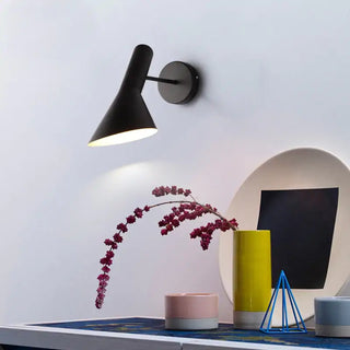 Matte black LED wall fixture in modern interior — ZITA designer sconce