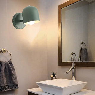 Small indoor wall sconce with vibrant color and warm glow