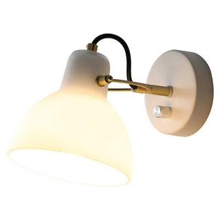 White glass soft glow minimalist wall sconce close-up
