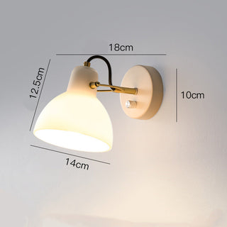 White glass minimalist wall sconce in bedroom — soft glow