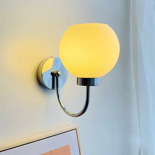 Bauhaus cream globe glass wall lamp illuminated — iron frame