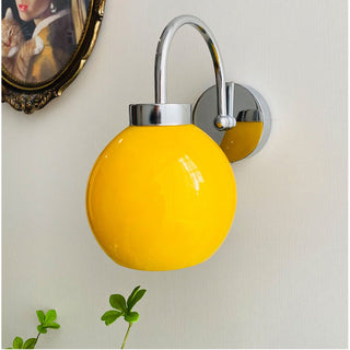 Bauhaus wall light cream globe glass — modern iron frame sconce