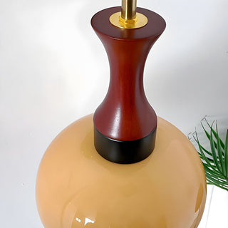 Retro yellow bowl wall lamp close-up — classic glass sconce