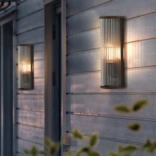 Contemporary minimalist outdoor wall sconce LED warm glow — exterior