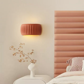 Cream resin macaroon wall sconce indoor ambient — living room