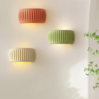 Cream resin macaroon indoor wall sconce detail — living room