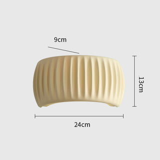 Macaroon cream resin indoor wall sconce close-up — living room