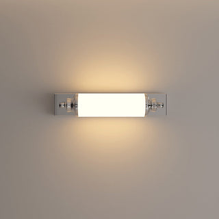 Chrome cylindrical LED wall lamp in hallway — modern sconce