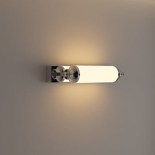 Cylindrical chrome LED wall lamp close-up — modern sleek