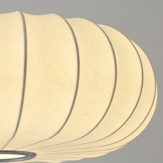 White pumpkin fabric pendant in interior — soft drum shade lamp
