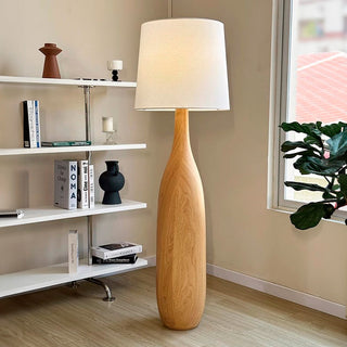 Retro wood floor lamp illuminated — vintage fabric warm