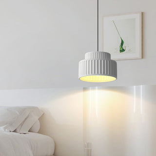 Contemporary pendant with resin shade over dining table