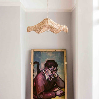 Bohemian pendant with natural rattan shade and warm glow