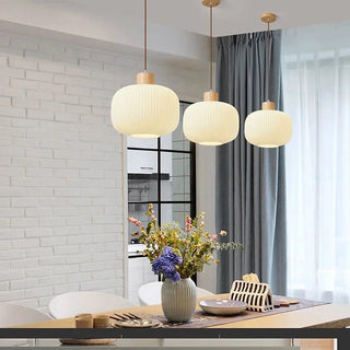 Pendant with lantern glass shade and warm amber glow
