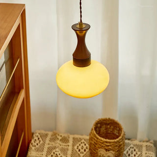 Retro yellow dome pendant over kitchen island