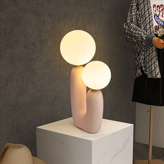 Twin orbs table lamp illuminated — warm glow ambient