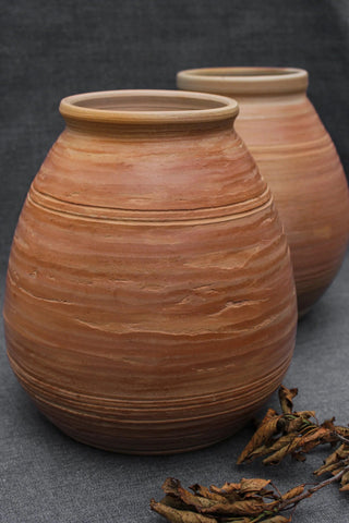 antique stoneware pitcher handmade rustic pottery unique smoke-fired design angle view